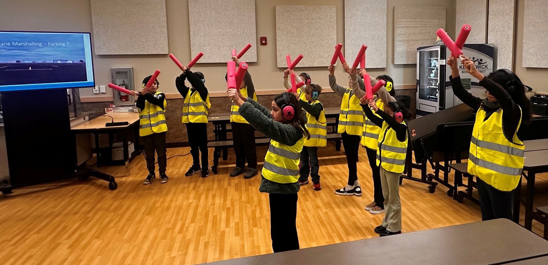 Students at Mid-Columbia Partnership learn airplane marshaling signals.